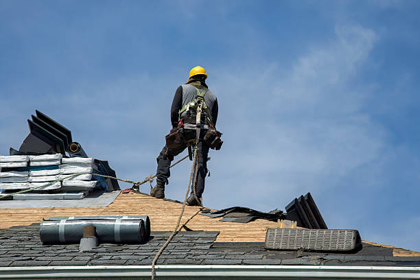 Professional Roofing technician working in East Quogue, NY